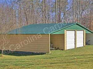 Boxed Eave Roof Style Seneca Barn with Two 9 x 8 Garage Doors On Main Building